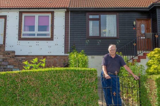 Mr Mitchell at his Milne Crescent home