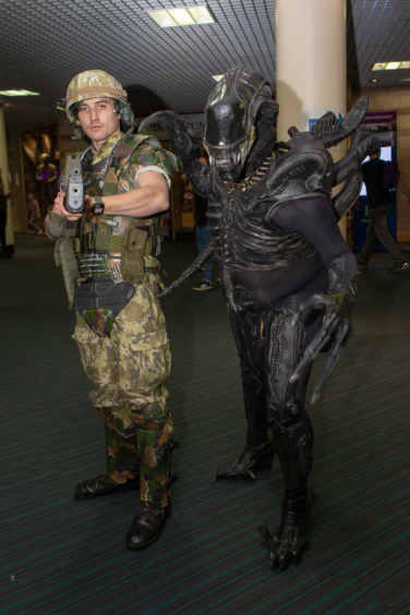 Chris Stevenson as a soldier and Sam Waters as Alien
