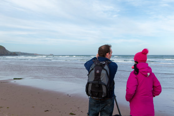 Landscape photographer Gavin Ritchie gives Gayle Ritchie a one-to-one lesson at Lunan Bay.