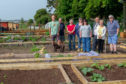 Members of Silverburn Allotment Society in their new plots with Peter Duncan from Fife Council. (Left) Martin Watson & dog Tess, Alistair & Shiela Simpson, Diana Wemyss, Karen Guthrie, Peter Duncan and Gill & Davie Swan