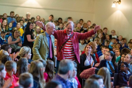 Sir Michael Morpurgo (right) arrives with Sir Hew Strachan at the Younger Hall.