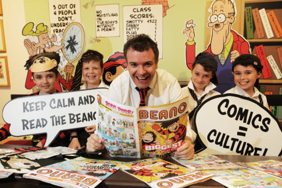 A new exhibition of all things Beano has opened with a class from Dundee High School attending. 
Picture shows; l to r, Sam Brass, 9, Finlay Thomas, 9, Head of Beano Studios Scotland, Mike Stirling, Matthew Milne, 10 and Sam Blackhall, 10