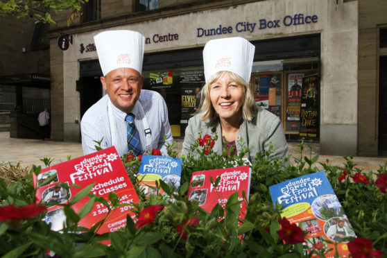 Convenor and Depute Convenor of Neighbourhood Services Kevin Cordell and Anne Rendall outside the box office where tickets are available.