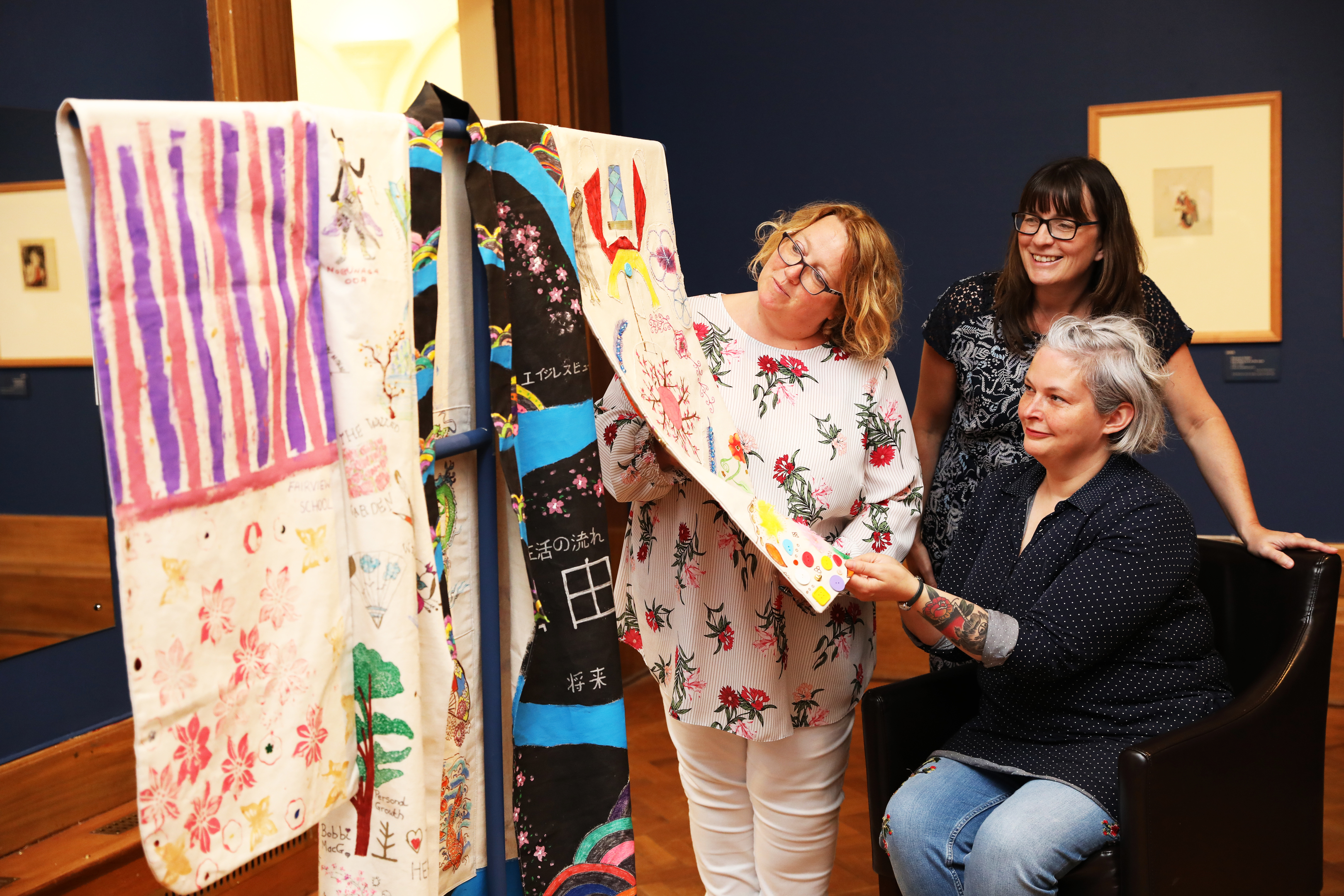 Helen Smout (left) chief executive of Culture Perth and Kinross admires the artwork with Judith Stewart from Corton Vale prison and artist Jill Skulina.
