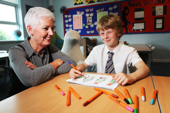 Painter Dawn Brooks and Thomas with his design.