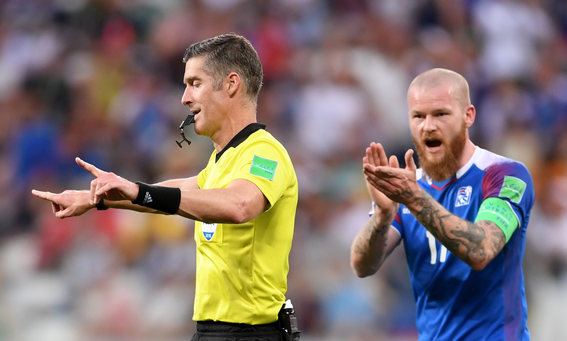 The familiar sight of a referee  signalling a VAR decision.