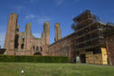 The worst of the Arbroath Abbey graffiti is behind scaffolding.