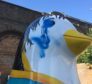 The penguin struck by graffiti at Victoria Bridge arches.