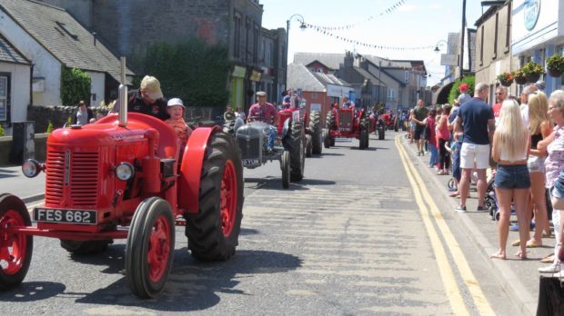 Vintage tractors and pipers led the procession of floats.