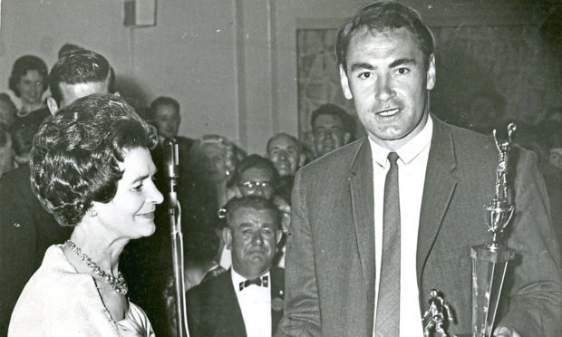 Alan Gilzean receives his player of the year trophy from Lady Provost Mrs McManus in 1964.