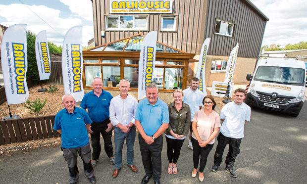 Balhousie Glazing founders Drew Hay (3rd from left) and Malcolm Sweeney (4th from left) with some of the firms employees.