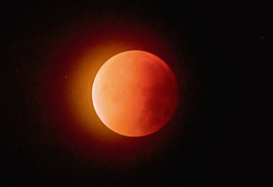 A blood red "supermoon" in the skies above Falkirk, created from a lunar eclipse with the moon near to its closest point to the Earth.