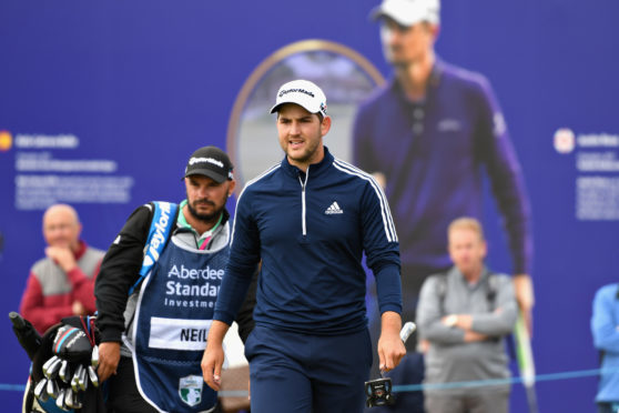 Bradley Neil reacts to a putt on hole eighteen during day one of the Aberdeen Standard Investments Scottish Open.