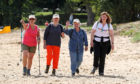 Charity campaigner Sarah Brown (right) with Great British Bake Off presenter Sandi Toksvig (second right), her wife Debbie Toksvig (second left) and actress Arabella Weir at Aberdour beach, as they continue along the 117-mile Fife Coastal Path.
