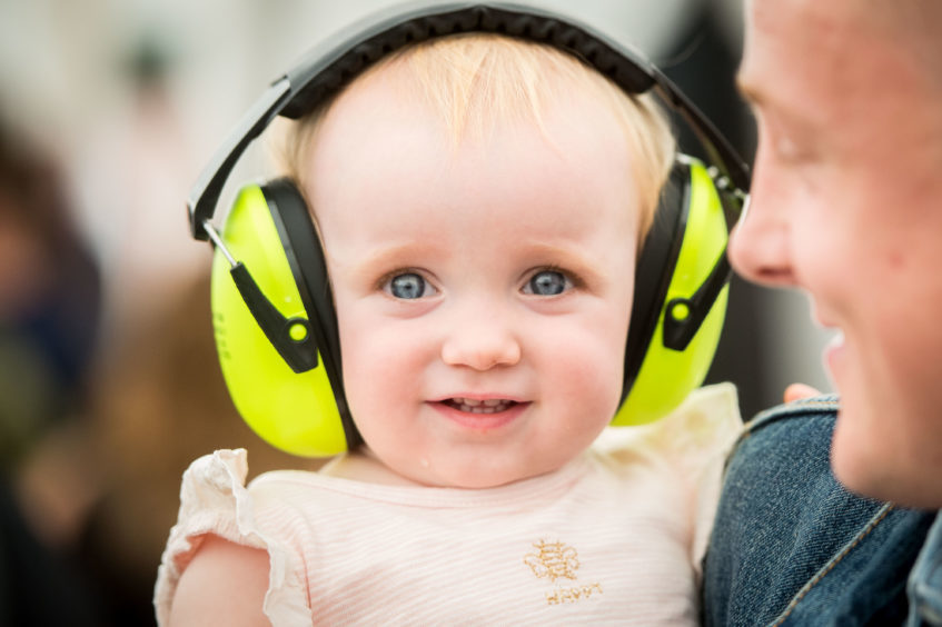 11 month old Aluna Welsh enjoying the day, thanks to ear defenders for the music.