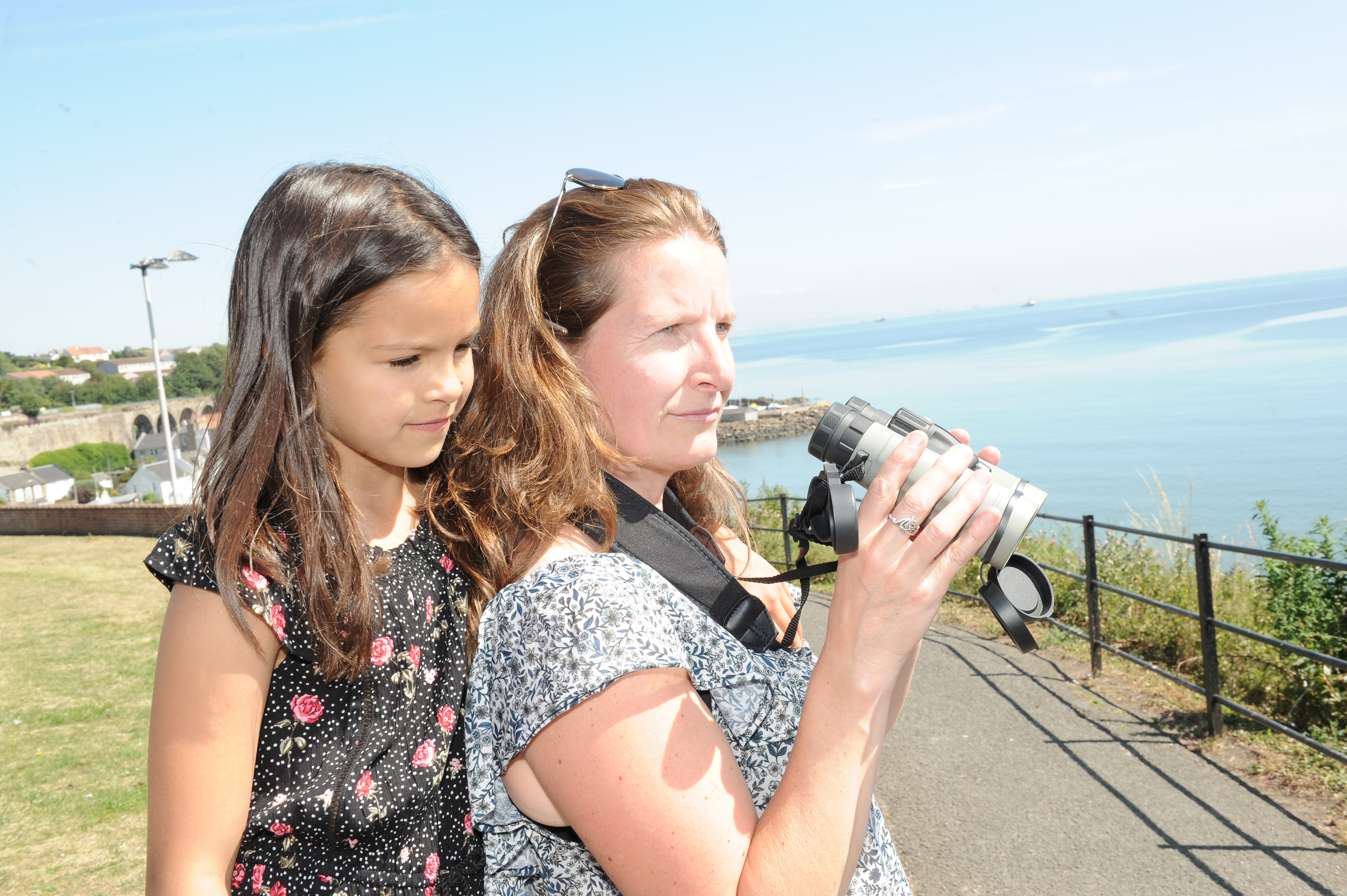 Sam Tedcastle looks out for whales from the paths above Kinghorn beach with daughter Hannah, 7.