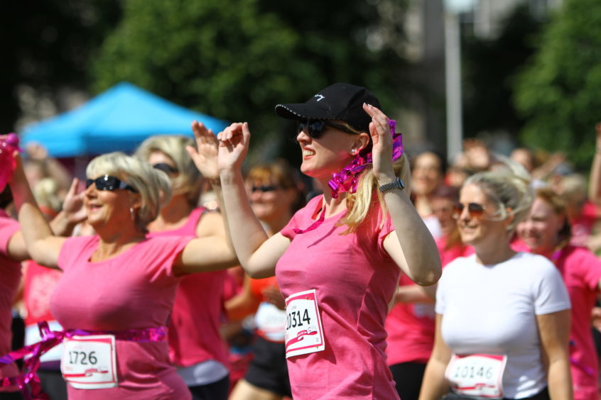 Participants warm up ahead of the Race for Life.