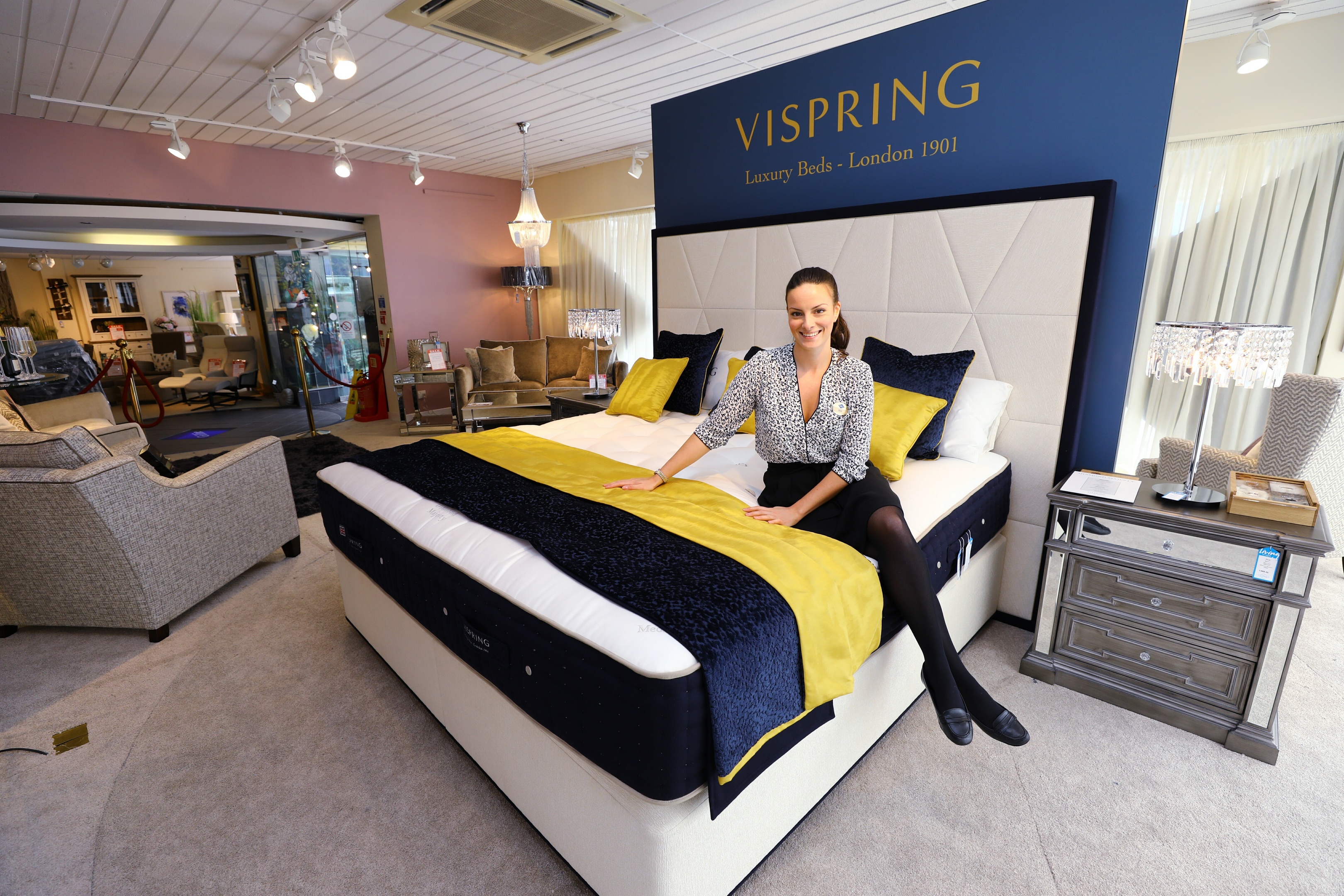 Gillies store assistant Sarah Robertson trying out the Vispring Diamond Majesty bed in Gillies showroom.