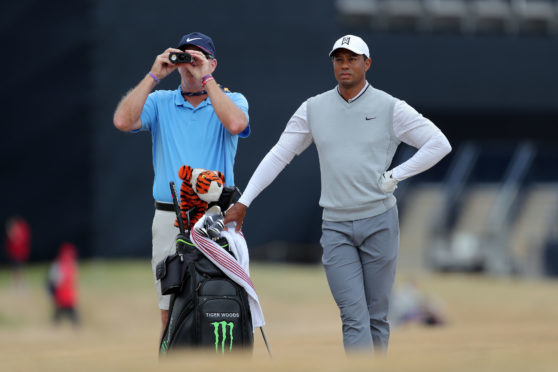 Tiger Woods with his caddy during preview day one of The Open Championship 2018 at Carnoustie Golf Links.