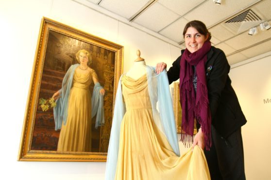 Visual arts officer Gill Ross with the portrait of Lady Sophie Lyell by artist James McIntosh Patrick, which is on show at the Meffan in Forfar, along with the dress worn in the painting.