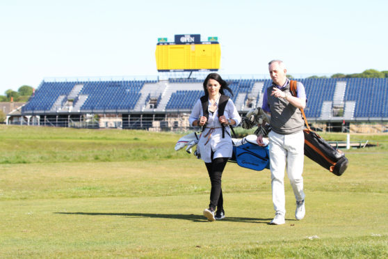 Head pro Colin Sinclair out on Carnoustie Golf Links with a novice player.
