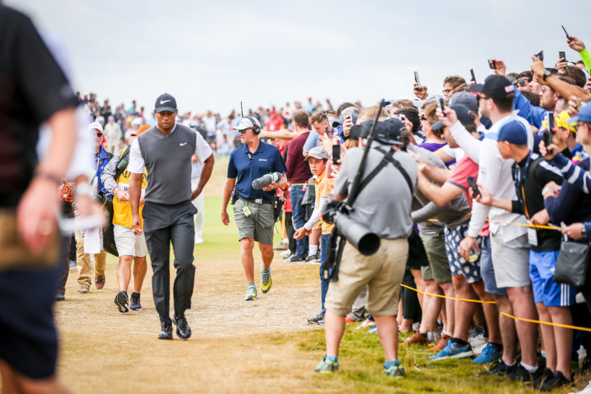 Large crowds following Tiger Woods around Carnoustie Golf Links.