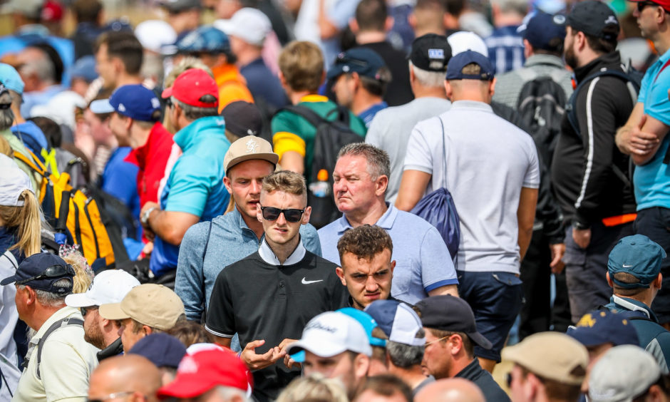 Large crowds following the big names around Carnoustie Golf Links and watching on the big screen.