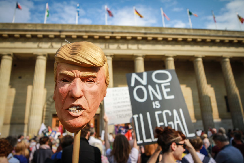 Hundreds of people gathered in City Square, Dundee, to protest President Donald Trump visit to the UK.

Pictures: Kris Miller.