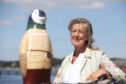 Maggie's Dundee centre director Lesley Howells poses with her favourite penguin, the NHS sponsored "Capguin Scott", at Broughty Ferry harbour.