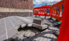 Barriers around the buckled pavement on Mill Street, Perth