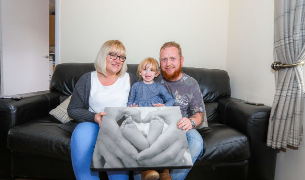 Anneka, Steven and Hayley with a picture of Geordies feet