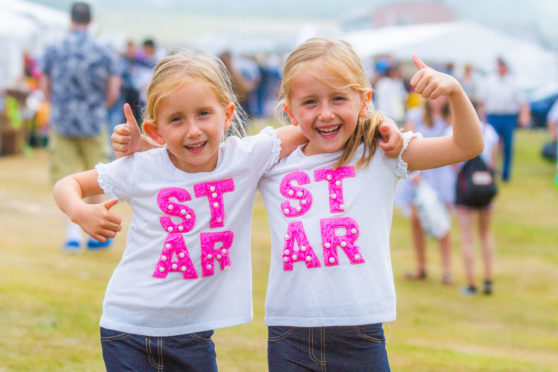 Twin sisters Grace and Holly Dixon, aged 5, enjoying St Andrews Harbour Gala.