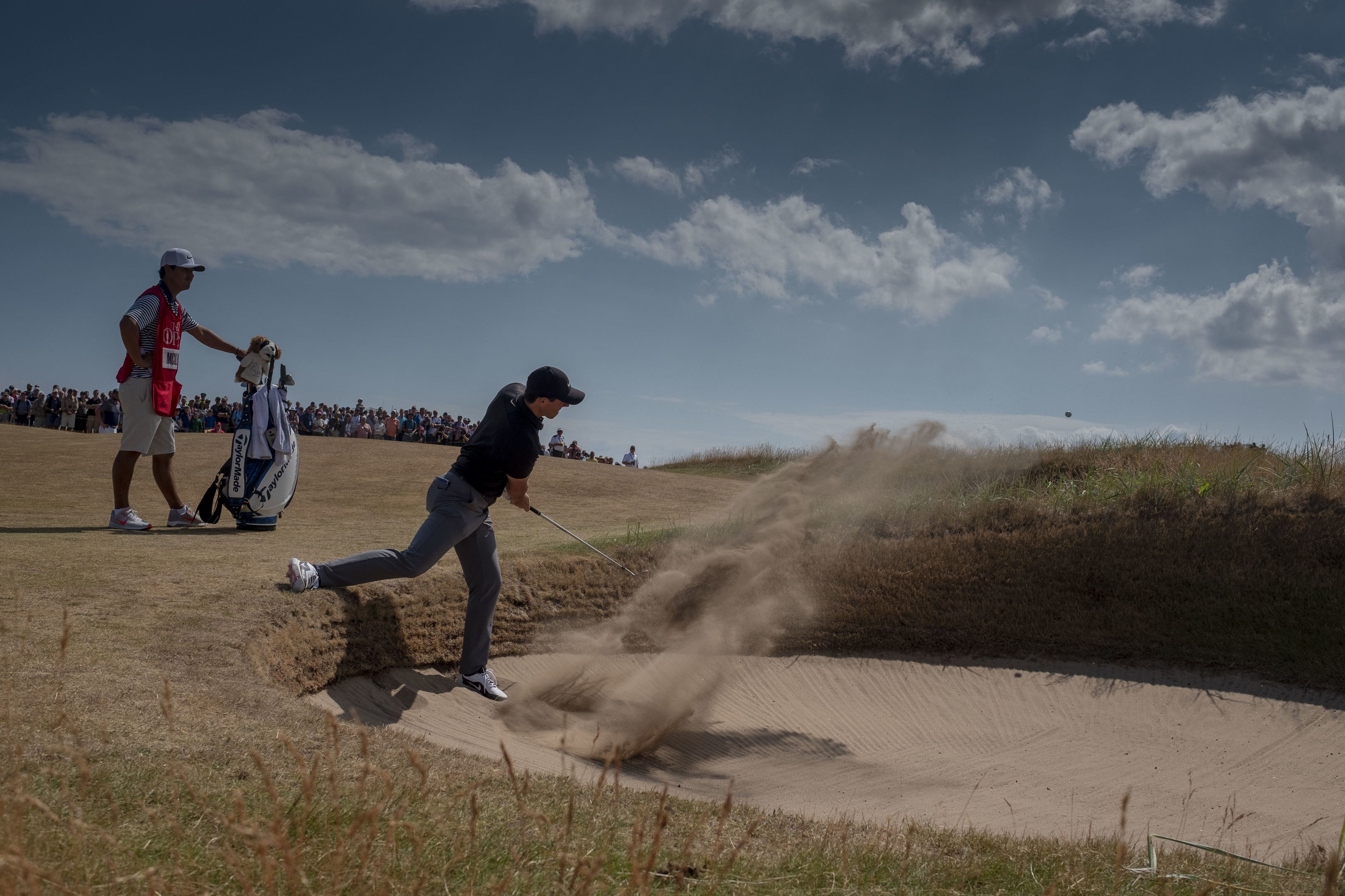 Rory McIlroy comes out of a bunker on his way to a two-under 69 on the opening day at Carnoustie.