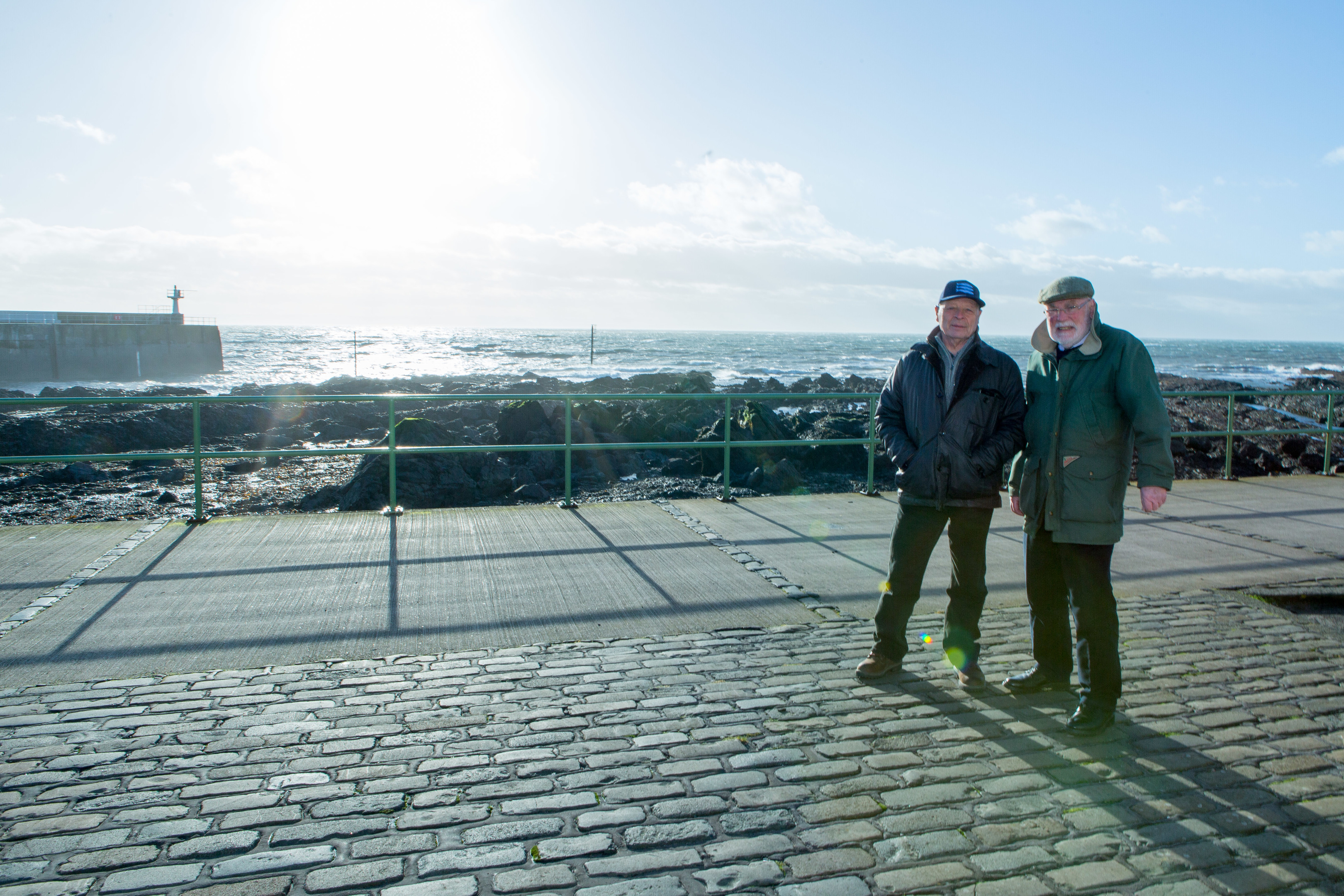 Former skipper Ronnie Hughes and Wullie McNaughton at Pittenweem harbour earlier this year, where the memorial to fishermen lost at sea is proposed to be located.