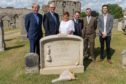 Rev Dr Russell Barr, Sandy Lyle, Sharon Allan (GGG Grandaughter), Roger McStravic, Mark Ritchie (Stonemason) and David Allan (Sharons son) at the new Headstone for Championship Golfer Jamie Anderson who was buried in a paupers grave