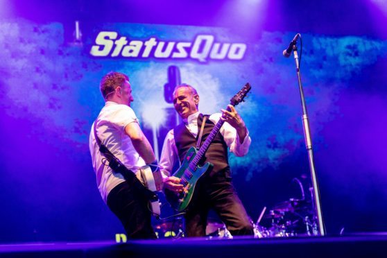 Status_Quo rocking on stage.