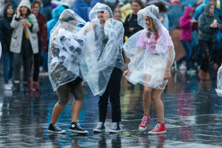 The rain ponchos were out for Rita Ora
