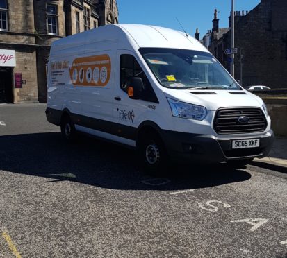 The van, advertising mobility aids, was spotted partially blocking a disabled bay and on double yellow lines.