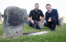 St Andrews stonemason Mark Ritchie (left) with golf historian Roger McStravick next to the gravestone in St Andrews Cathedral that was erected by Jamie Anderson for his infant son.