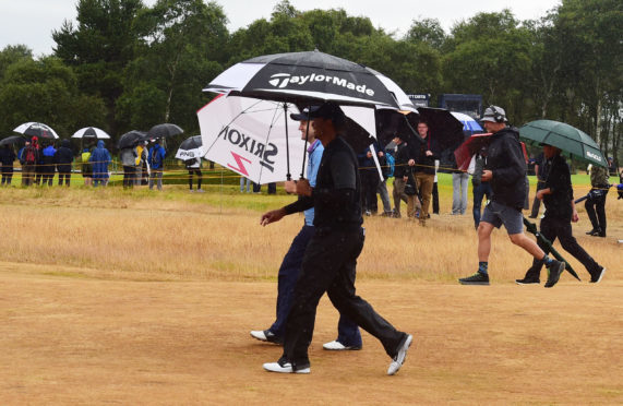 Russell Knox and Tiger Woods.