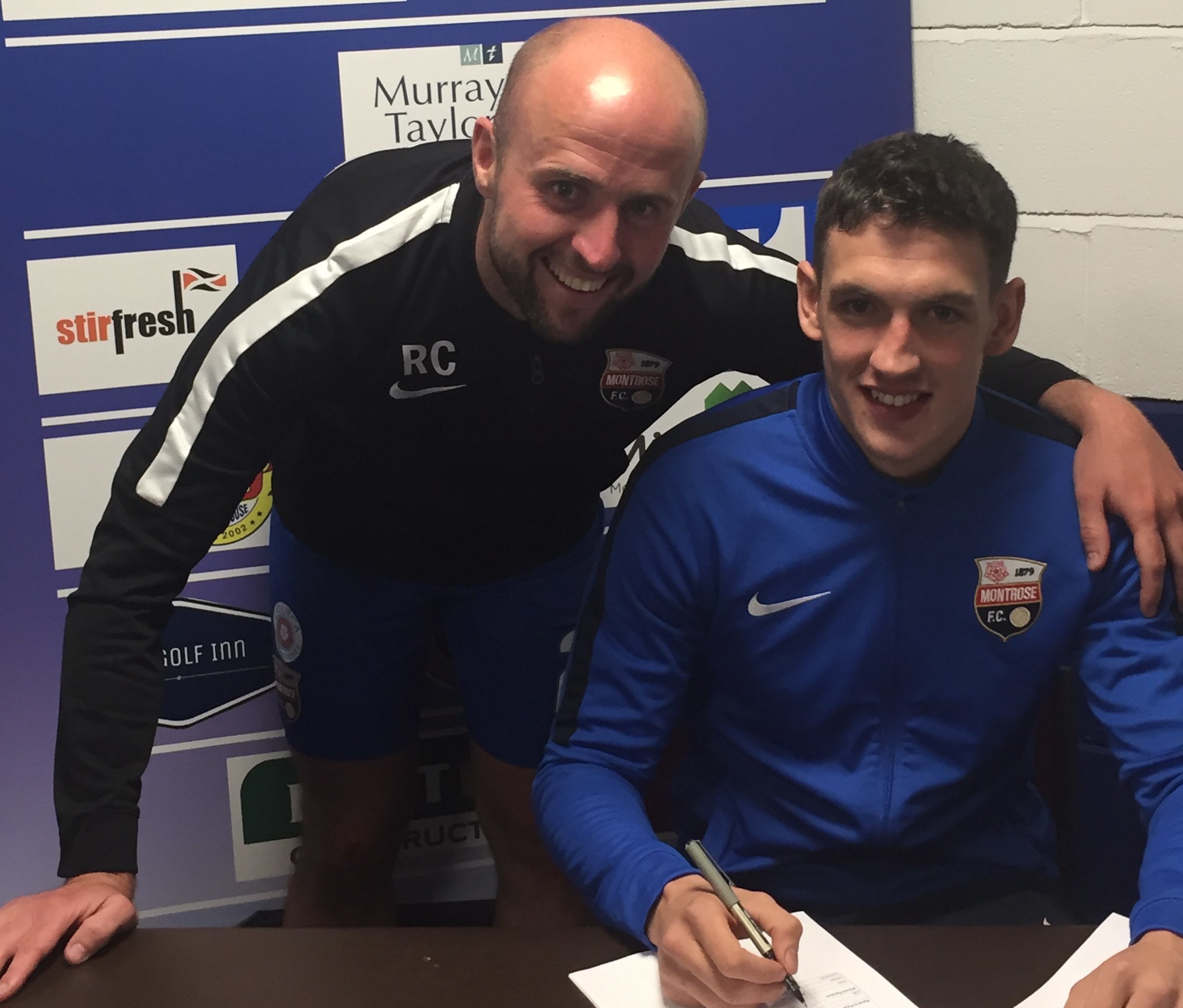 Montrose assistant boss Ross Campbell with Martin Rennie as he signs new deal.