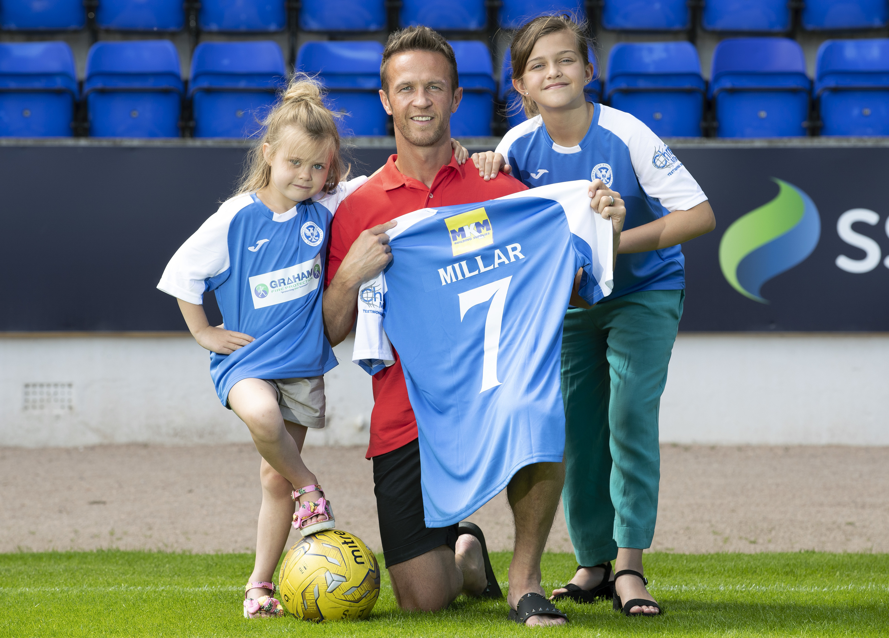 Former St Johnstone player Chris Millar pictured ahead of his testimonial game against Aberdeen this weekend with his daughters Sophia (6) and Ellie (11) showing off the testimonial kit.