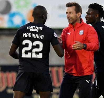 Neil McCann celebrates with Kharl Madianga.