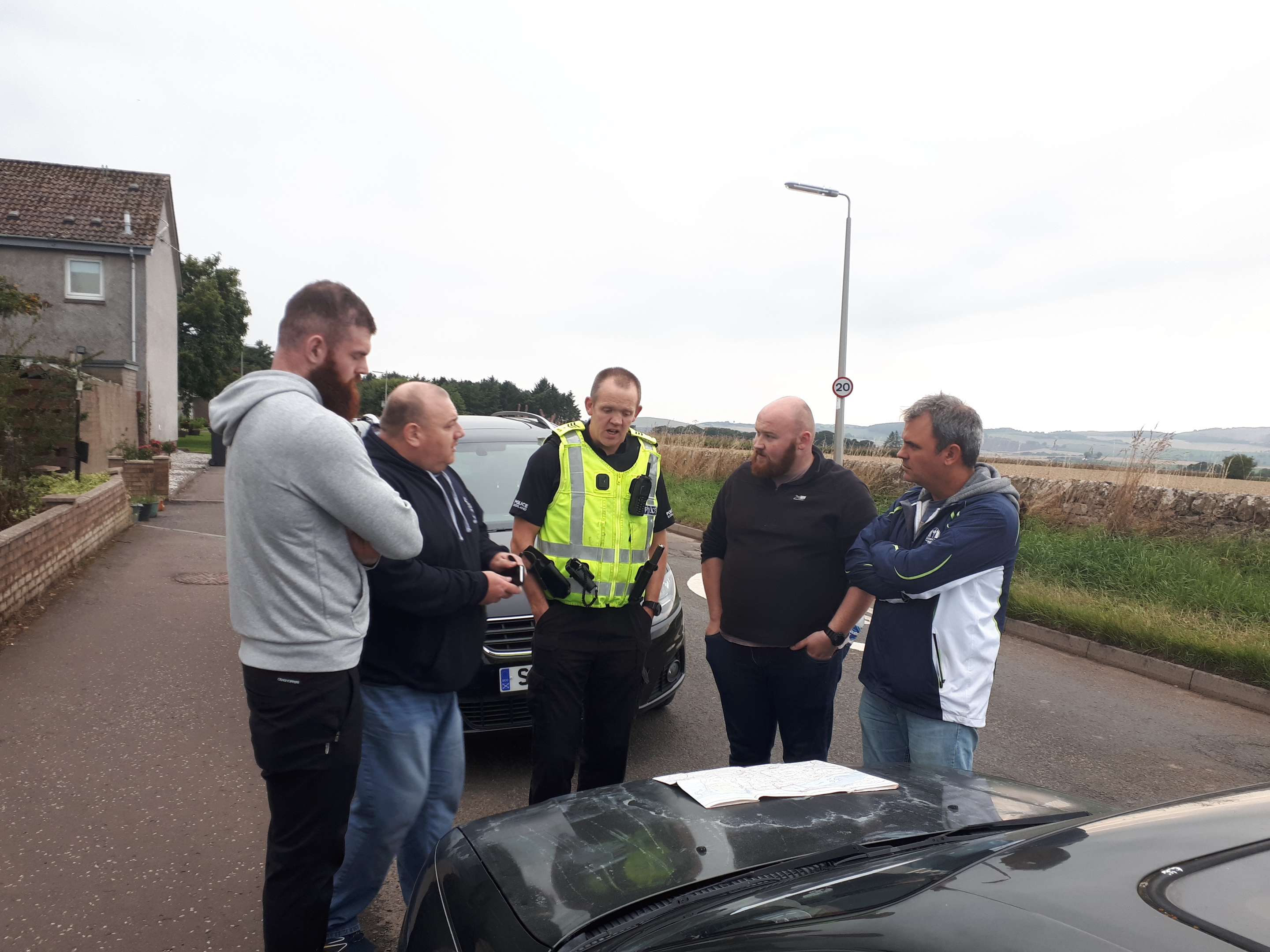 Police with members of the Howe of Fife rugby club