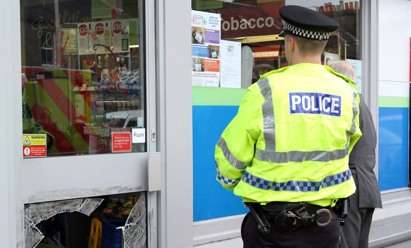 Police surveying the scene of a break-in in Invergowrie.