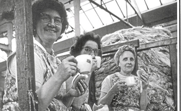 Everyone needs a break: Dundee mill workers take time out for a cup of tea