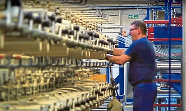 A worker at Low & Bonar's Caldrum Works in Dundee