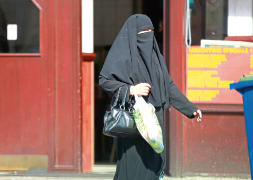 A Muslim woman wearing a Burka.