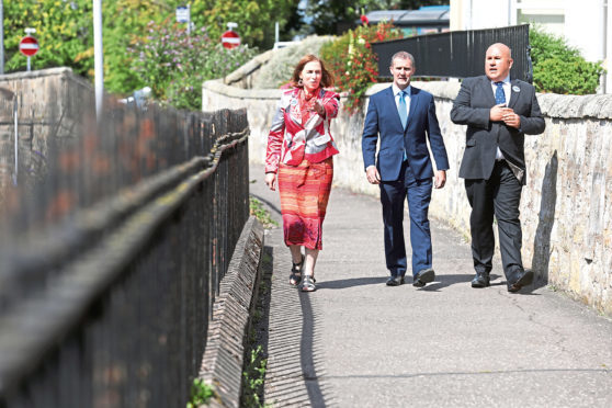 Jane Ann Liston (Convenor StARlink) Michael Matheson, Transport Secretary and Dita Stanis-Traken (Secretary for StARlink) on what used to be part of the old railway.