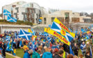 Thousands of people join Hands off our Parliament (HOOP) demo at Scottish Parliament. The demonstration surrounded Holyrood with a living chain of hands. March 23 2018